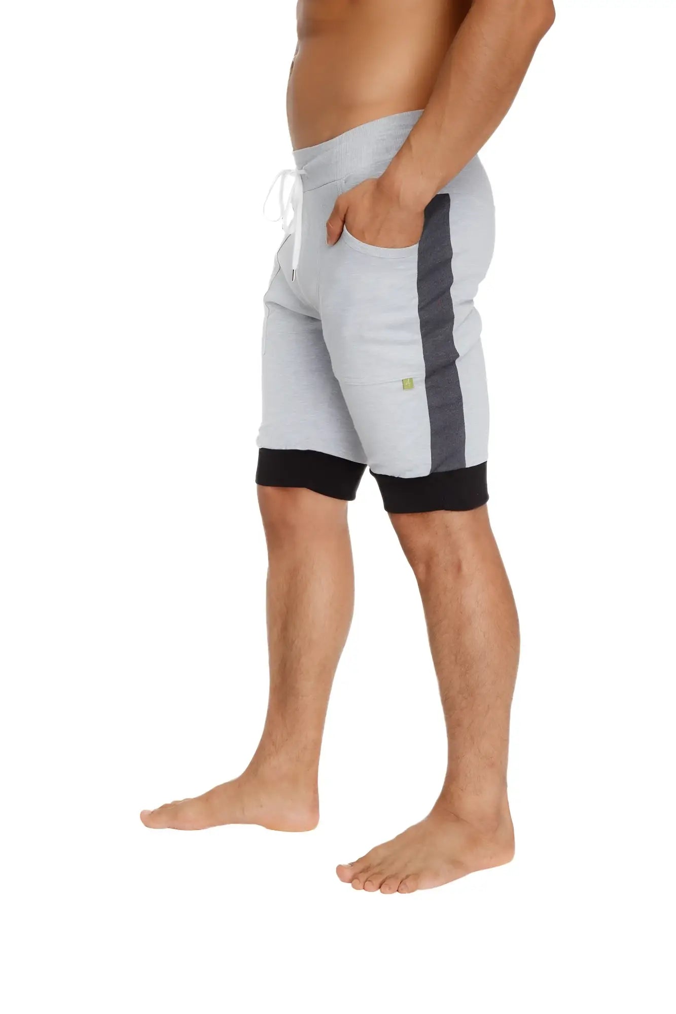 Light gray cuffed yoga shorts with dark gray side stripe black hem and white drawstrings for athletic wear