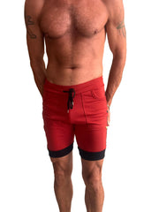 Red cuffed yoga shorts with charcoal and black trim and a drawstring waistband for athletic wear