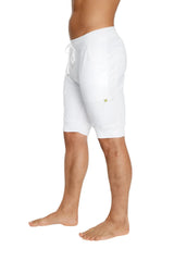 White cuffed yoga shorts with soft stretchy fabric and a subtle green logo on the side