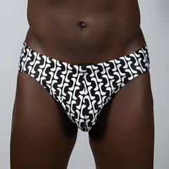 Curves print brief swim trunks in black and white with a bold wavy geometric pattern for stylish beachwear
