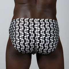 Curves print brief swim trunks with a black and white bold wavy geometric pattern for stylish beachwear