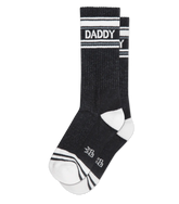 Black daddy crew socks with white stripes and bold text made from textured knit athletic material