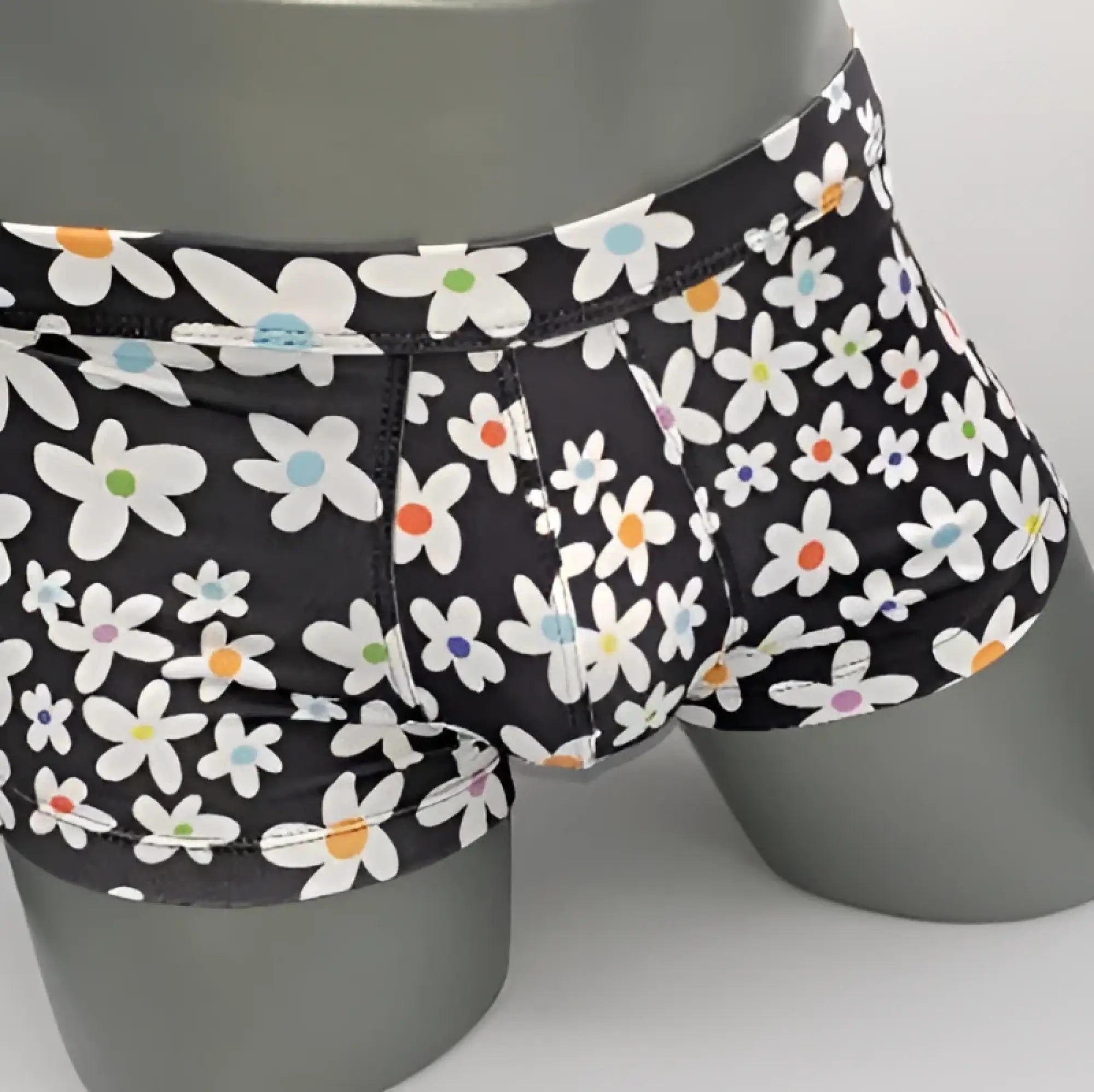 Black briefs daisy sq cut with playful white daisies featuring colorful orange blue and purple centers