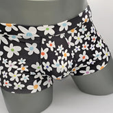 Black briefs daisy sq cut with playful white daisies featuring colorful orange blue and purple centers