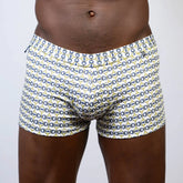 White boxer briefs with a repeating navy blue and yellow horseshoe buckle print designer square cut trunk