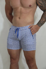 Designer print linen texture shorts featuring blue and white geometric patterned swim trunks with matching drawstring