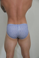 Designer print swim brief in blue and white featuring a repeating greek key pattern for swimwear use