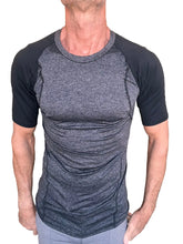 Men’s designer raglan crew-neck tee with heathered charcoal torso and solid black sleeves with subtle seam detailing