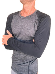 A men’s long-sleeved designer raglan crew-neck tee in charcoal heather gray body with black sleeves