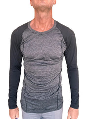 A men’s fitted long-sleeved athletic shirt in charcoal heather gray with black raglan sleeves for active wear