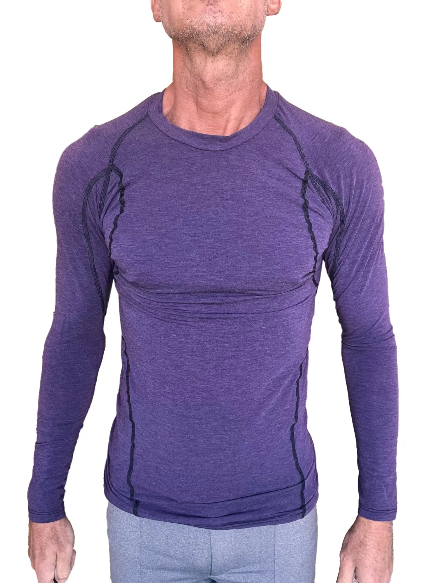 Designer raglan crew-neck long sleeve tee in eggplant purple with black seam detailing for athletic wear