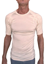 Beige short-sleeved designer raglan crew-neck tee with fitted moisture-wicking fabric and subtle seam detailing