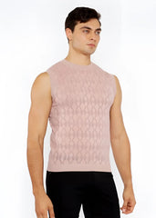 A soft pink sleeveless diamond pointelle knit vest with subtle textured pattern perfect for layering