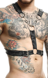 Black leather cross chain harness by DNGEON with silver metal rings and buckles for edgy fashion styling