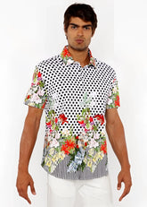 A vibrant short-sleeved dots abstract s s woven modal border shirt with black polka dots and colorful floral accents