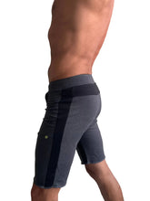 Eco-track short charcoal with black featuring dark gray athletic fabric and a black vertical stripe with elastic waistband