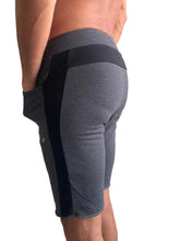 Eco-track short charcoal w black athletic shorts with ribbed waistband side panels and green logo on thigh