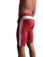Eco-track short in cinnabar red with white and silver striped side panel designed for athletic use