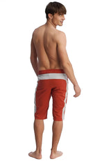 Eco-track red athletic shorts with white side stripes and a gray waistband designed for active wear