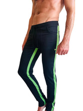 Black eco-track and yoga sweat pant in bamboo green with vibrant neon green side stripes for athletic use