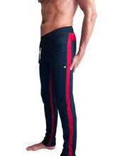 Black eco-track and yoga sweat pants with bold cinnabar side stripes and a drawstring waistband for comfort