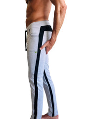 Light gray eco-track and yoga sweat pant with black vertical stripes, drawstring waistband, and side pockets