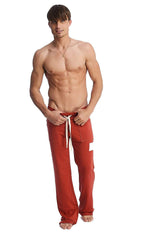 Edge eco-track and yoga sweat pant in cinnabar red with white drawstrings and a small white thigh patch