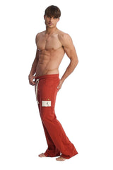 Edge eco-track and yoga sweat pant in cinnabar red with white drawstring and thigh patch in loose fit design