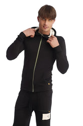 Black edge form-fit crossover yoga track hoodie with light green zipper and white inner lining for performance wear