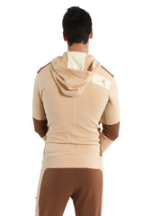 Edge form-fit crossover yoga track performance hoodie in sand and chocolate with white logo patch on shoulder