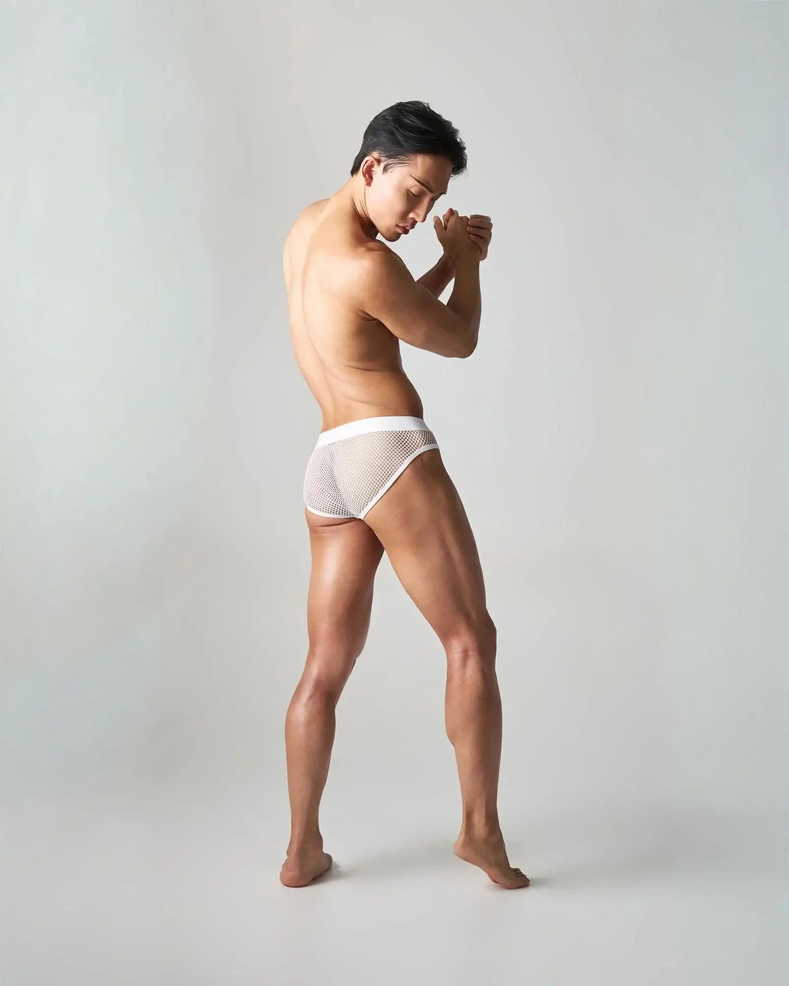 White mesh briefs with solid white waistband edge net brief showing breathable lightweight underwear design
