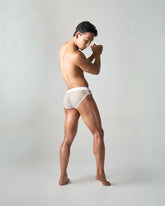 White mesh briefs with solid white waistband edge net brief showing breathable lightweight underwear design