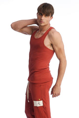 Red ribbed tank top with classic scoop neckline and fitted silhouette in cinnabar from edge sustain collection
