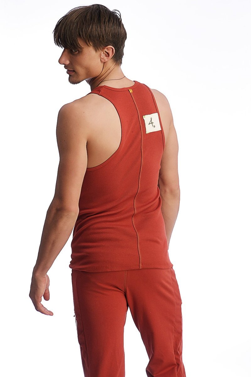 Back view of edge sustain tank top cinnabar in rust red with sleeveless design and central zipper detail