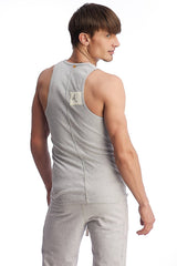 Back view of edge sustain tank top in heather grey featuring a gray heathered fabric and small white label
