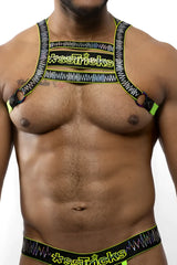 Neon green and black patterned electro holographic harness with xse*ricks branding designed for a bold look