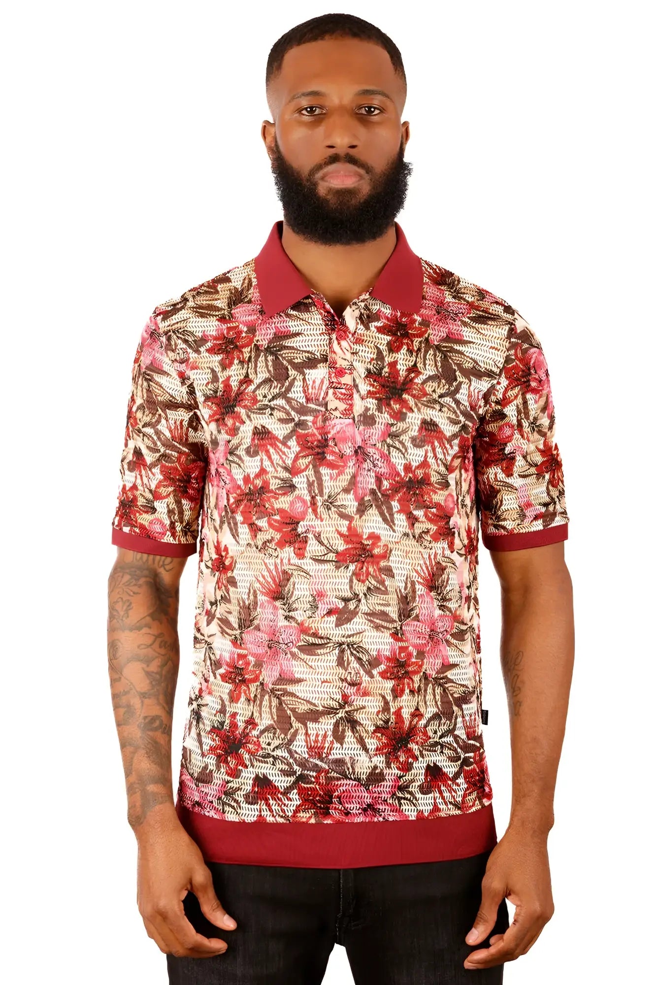 A man wearing an Entwine Form polo shirt with vibrant red and brown floral pattern on light beige fabric with maroon trim