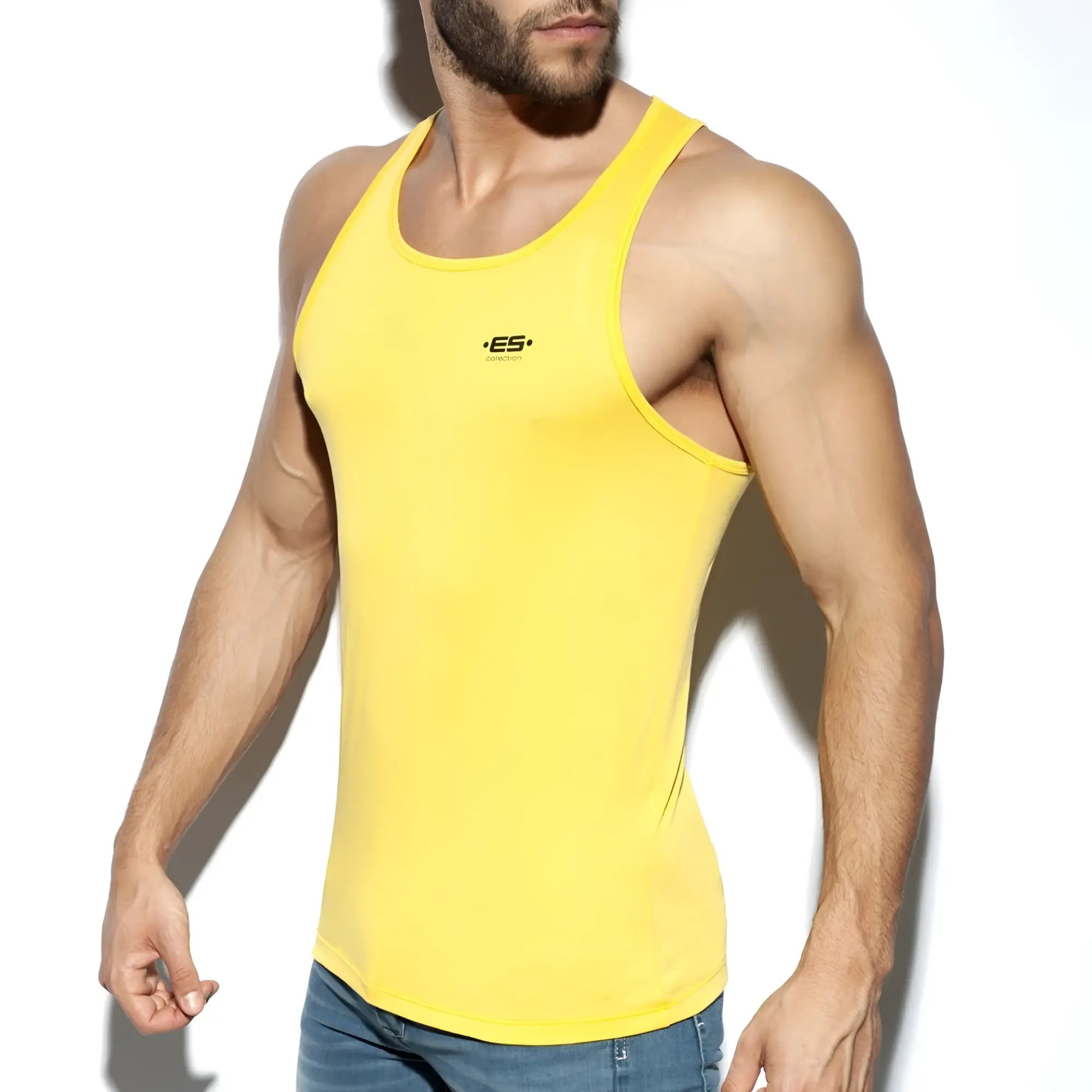 Bright yellow es basic tank form-fitting tank top with small black logo on chest ideal for casual wear