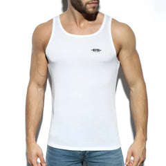 White men’s basic tank top with small black logo on chest made from soft breathable fabric