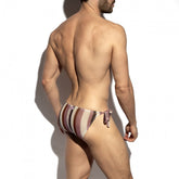Rear view of a man wearing ES Collection Topkapi bikini brief swimwear in violet with vertical stripes and side ties.