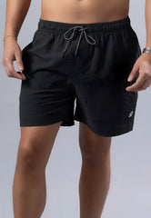 Black textured essential swim short with gray drawstring waistband and small white logo on lower right leg available in 3 colors