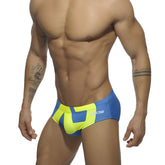 Extra-large logo brief swim trunks in vibrant blue and neon yellow with bold geometric design for swimming and beachwear