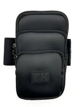 Black fk sport neoprene armband with three zippered pockets and textured fabric finish for secure storage