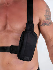 Black nylon fk sport cross body bag with subtle texture and small rectangular logo patch on front
