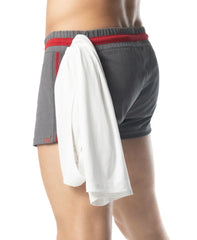 Flex trunk short gray athletic shorts with red trim featuring a white ribbed towel draped over the waistband
