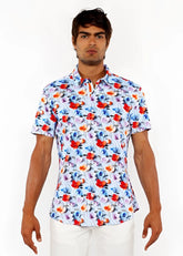 A vibrant white floral 3D print stretch knit shirt with bold red and blue blossoms and pink accents