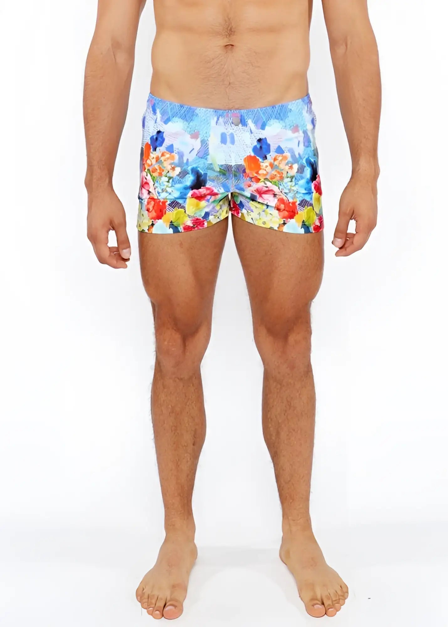 Vibrant multicolored floral abstract printed swim shorts with lively castle print in blue red yellow and orange