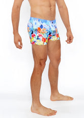 Floral abstract printed swim short featuring vibrant red orange yellow and blue floral patterned swim trunks