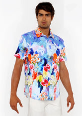 Vibrant short-sleeved woven modal button-up shirt with bold abstract floral pattern in blue pink orange and yellow