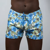 Floral print linen texture shorts in blue and green with a drawstring waistband and floral swim pattern